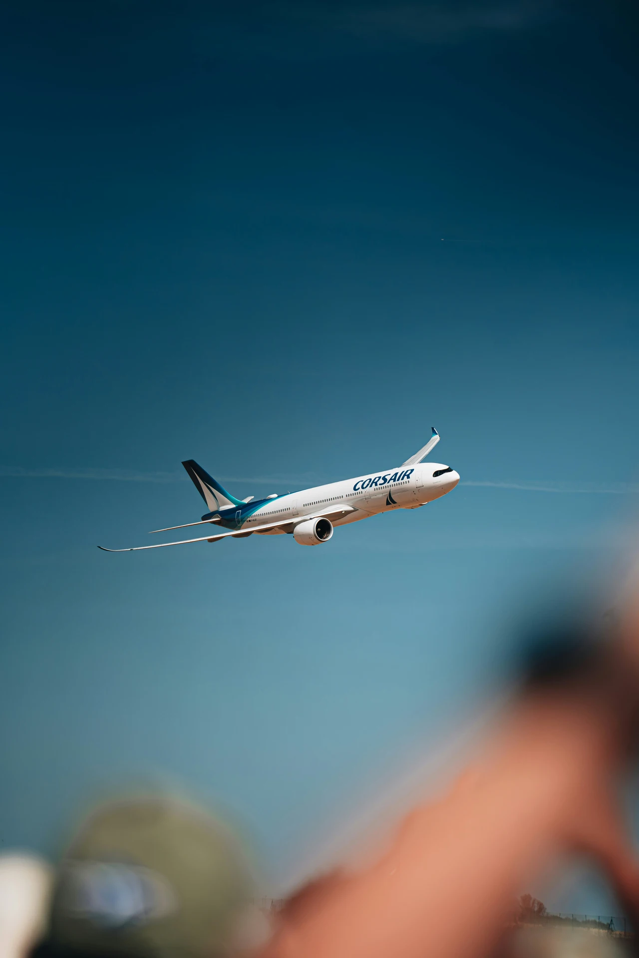 Passenger aircraft in flight against a blue sky